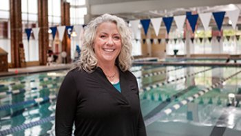 Woman standing outside swimming pool area