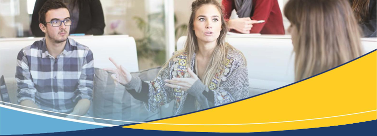Young professionals in discussion at table with yellow and blue banner overlay