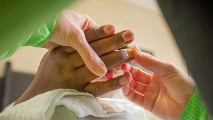 Image of healthcare professional looking at hands