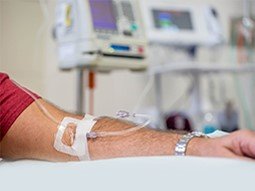 close up view of a man’s arm while having anesthesia at hospital