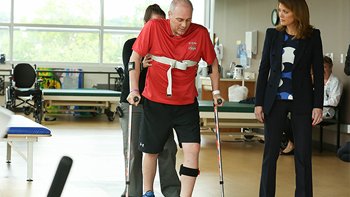 Therapist working on physical therapy of senior patient